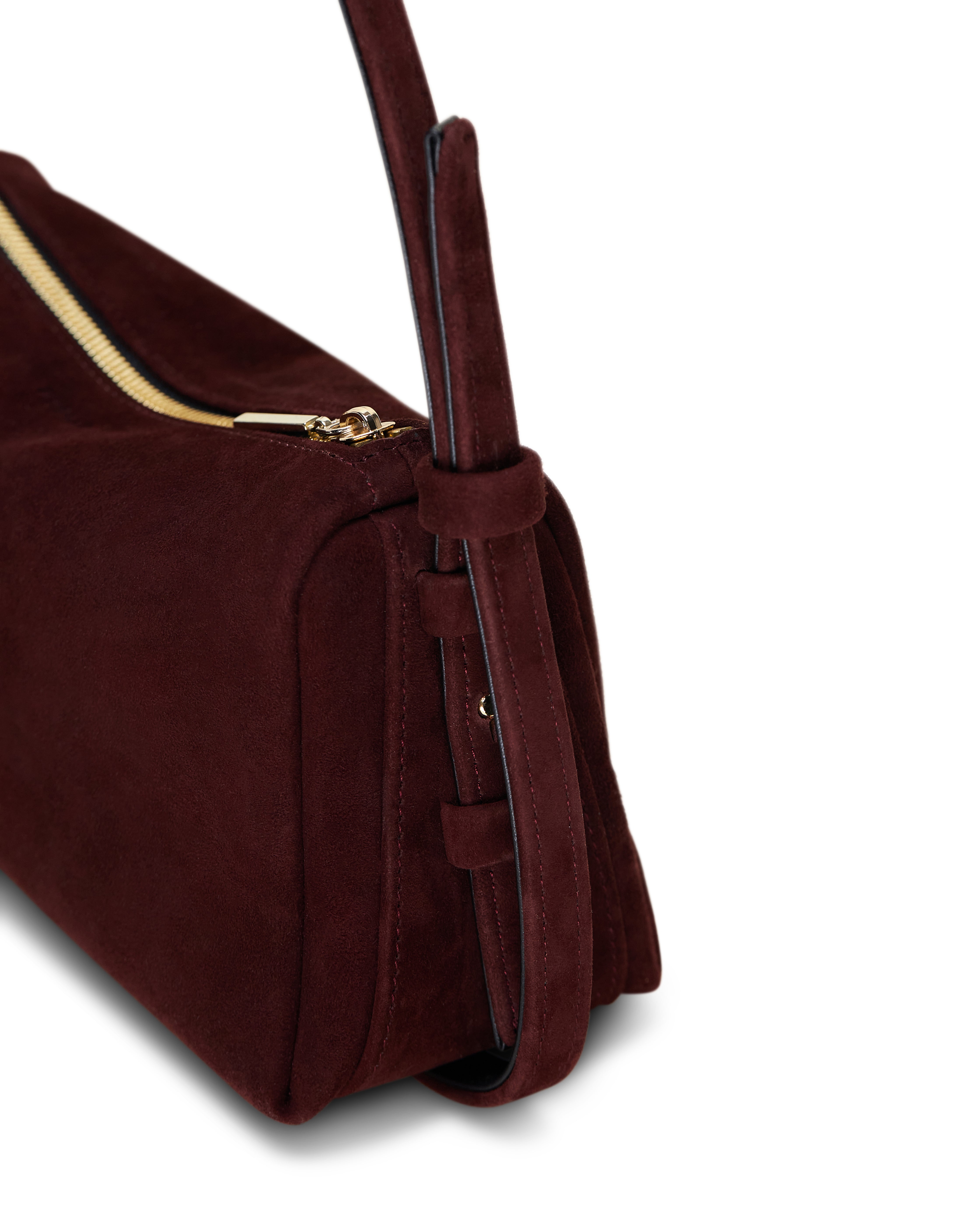 Poelle Atelier elegant small leather bag in dark burgundy suede with gold zipper detail