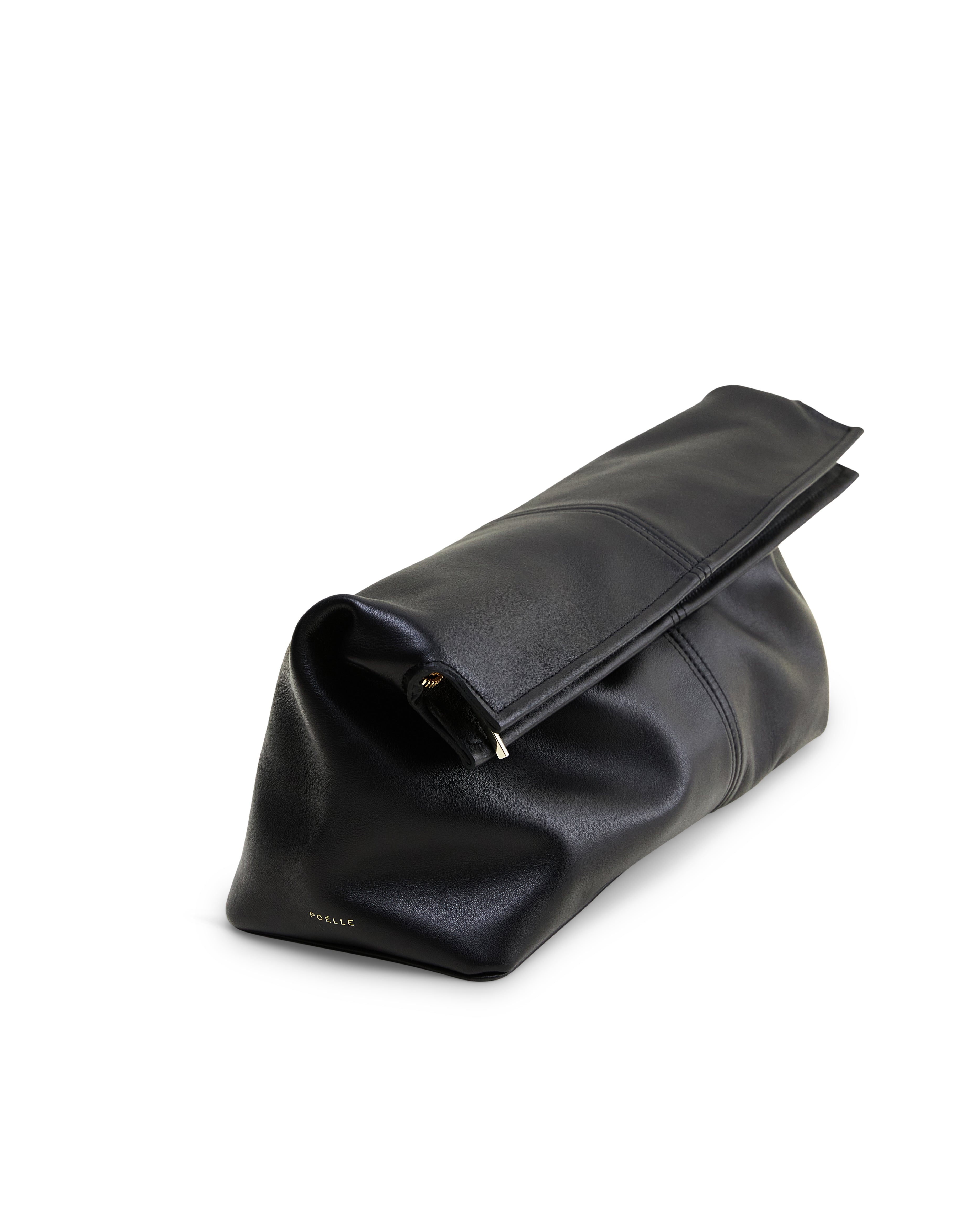 Poelle Atelier black luxury leather clutch bag with sleek fold-over design and smooth finish