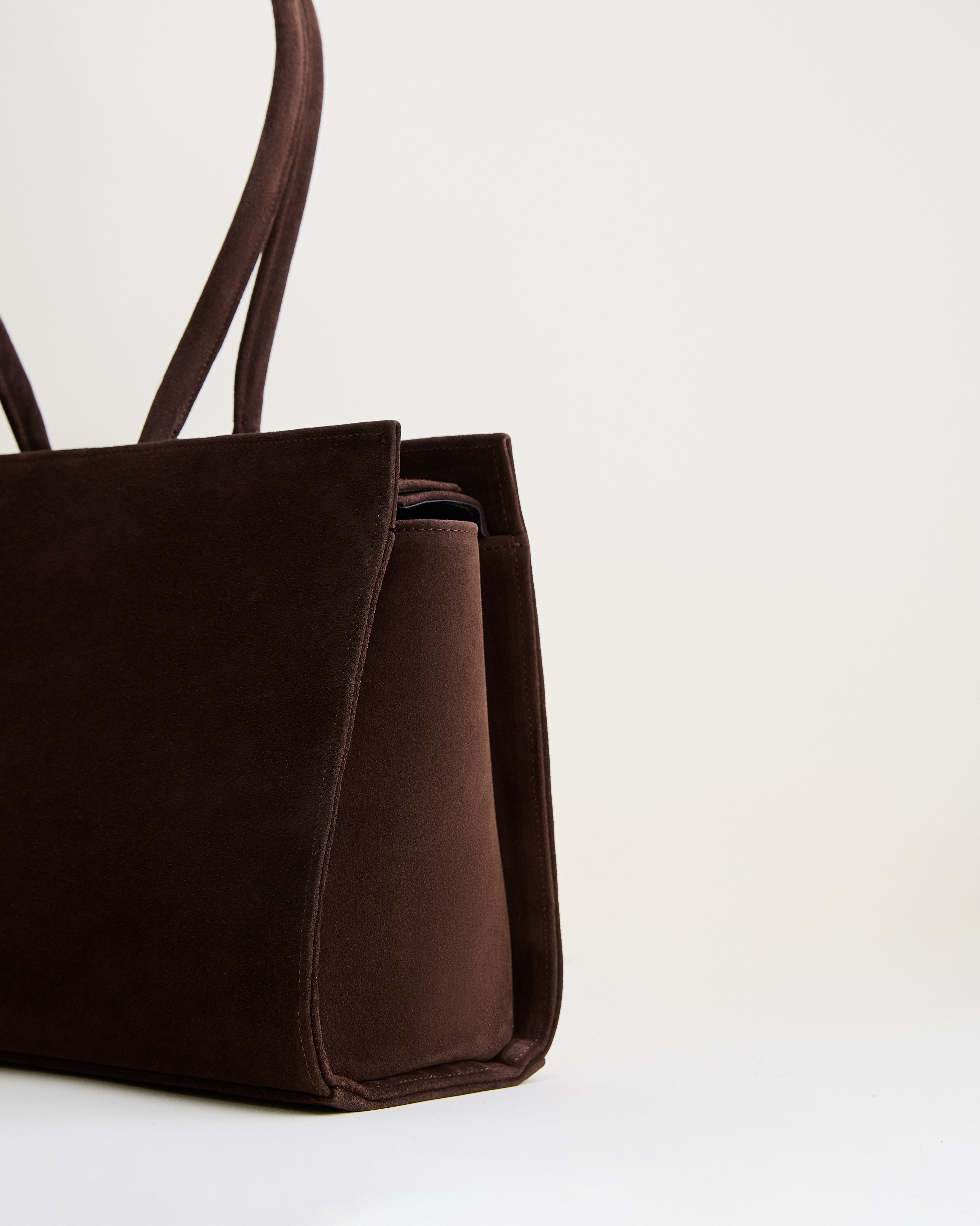 Poelle Atelier luxury suede tote bag in dark brown with soft texture and long handles