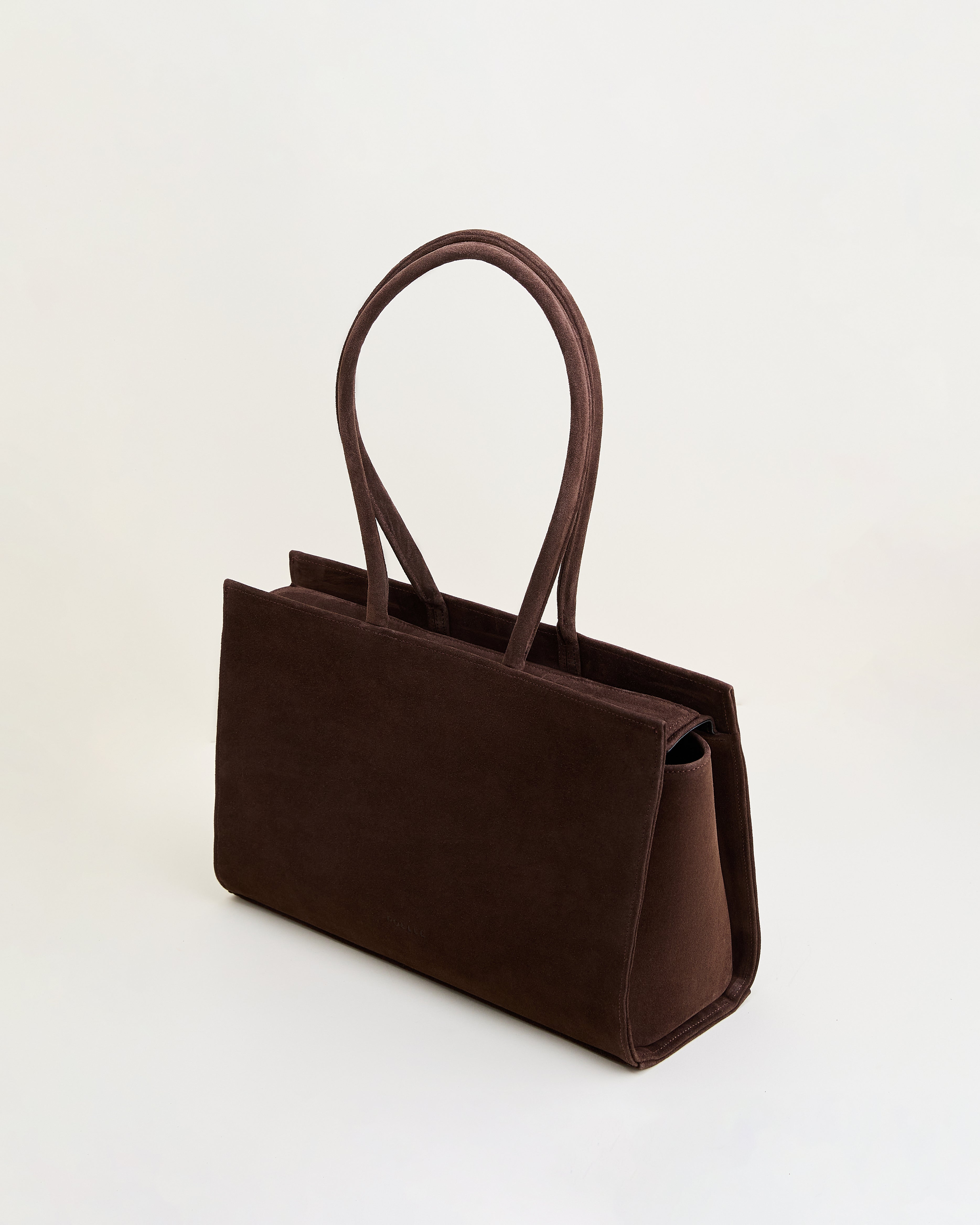 Poelle Atelier luxury suede tote bag in dark brown with structured design and double handles