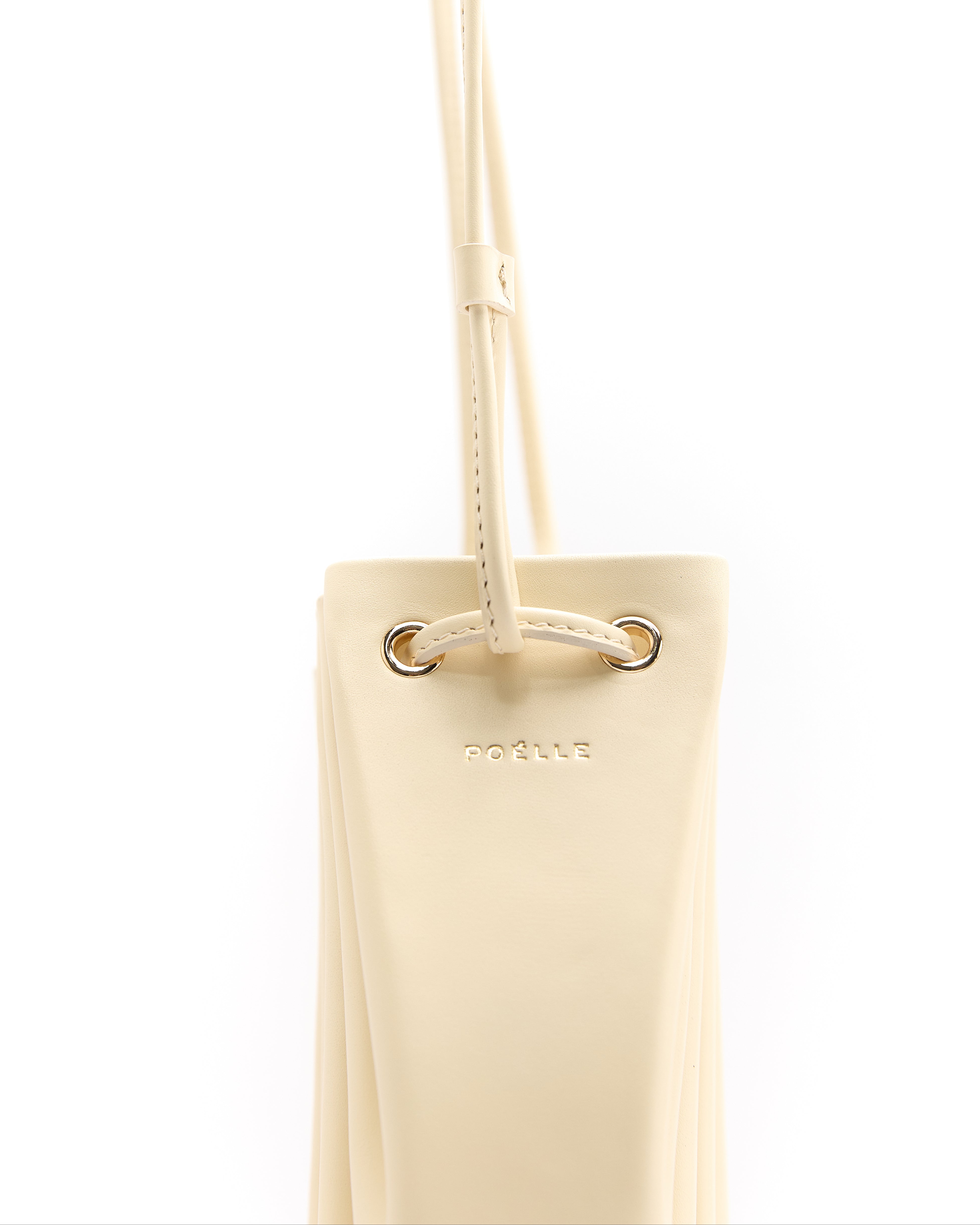Poelle Atelier luxury summer crossbody bag in beige with adjustable strap and gold-tone hardware