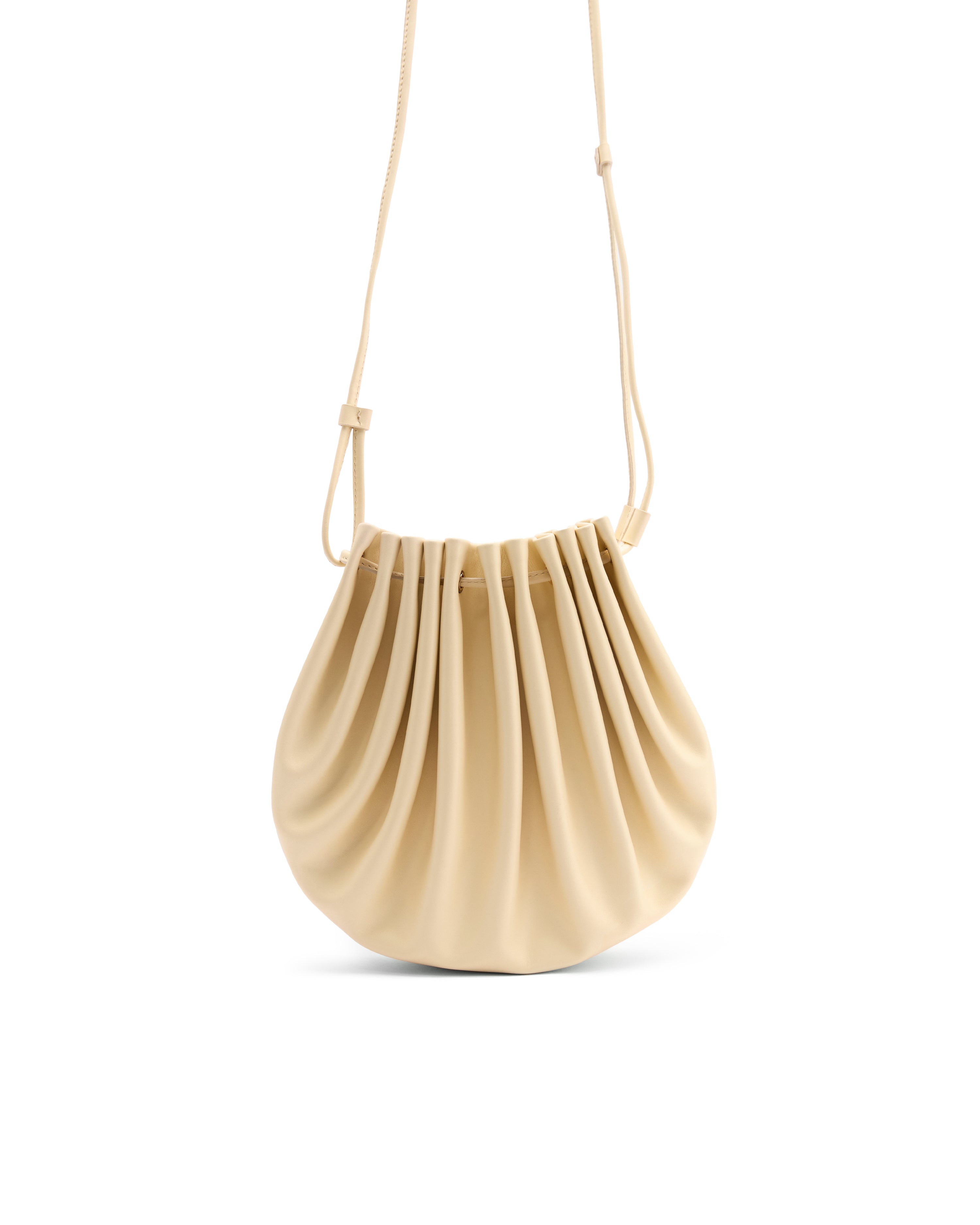 Poelle Atelier luxury summer crossbody bag in beige with pleated design and adjustable strap