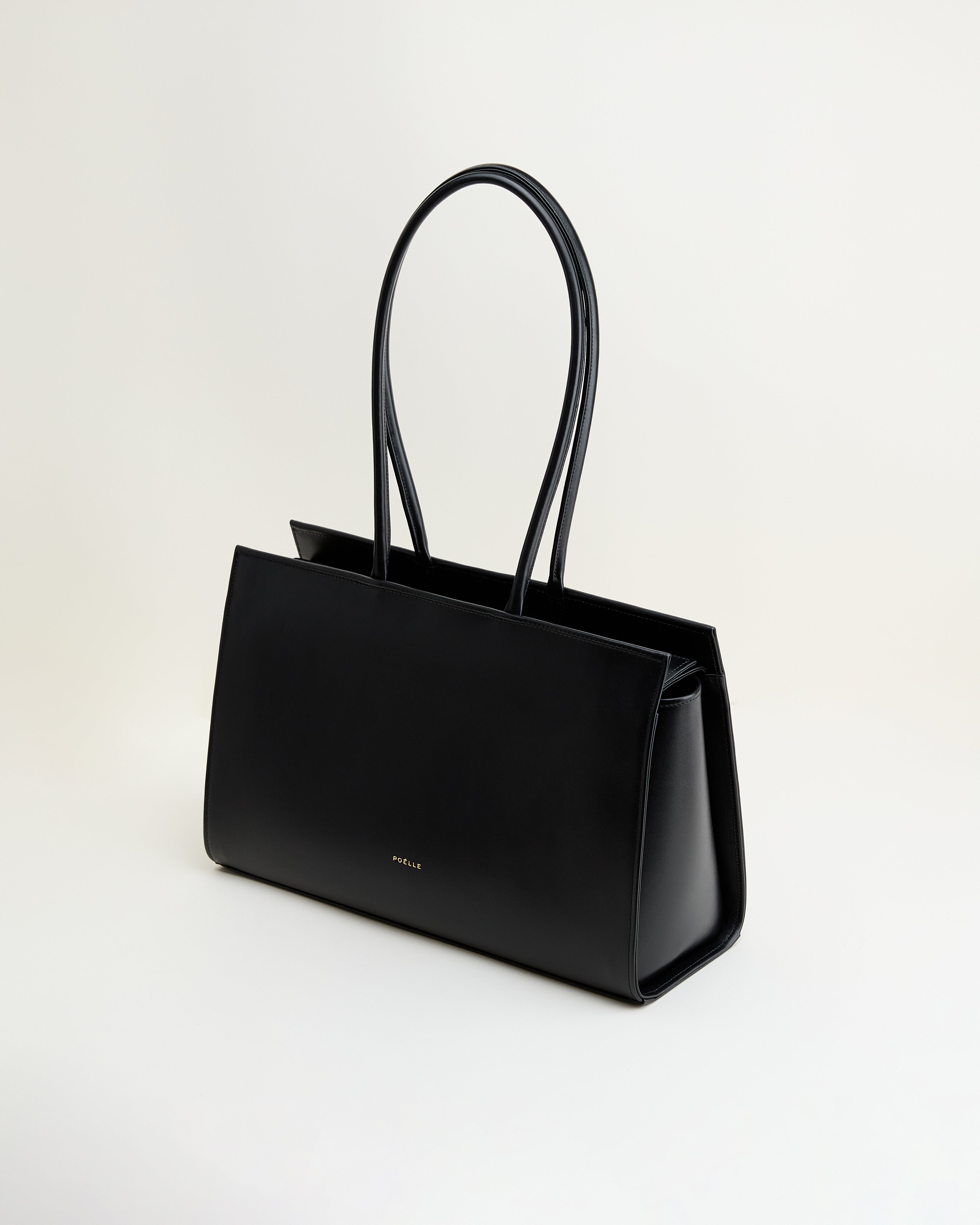 Poelle Atelier luxury black tote bag with sleek design and long handles