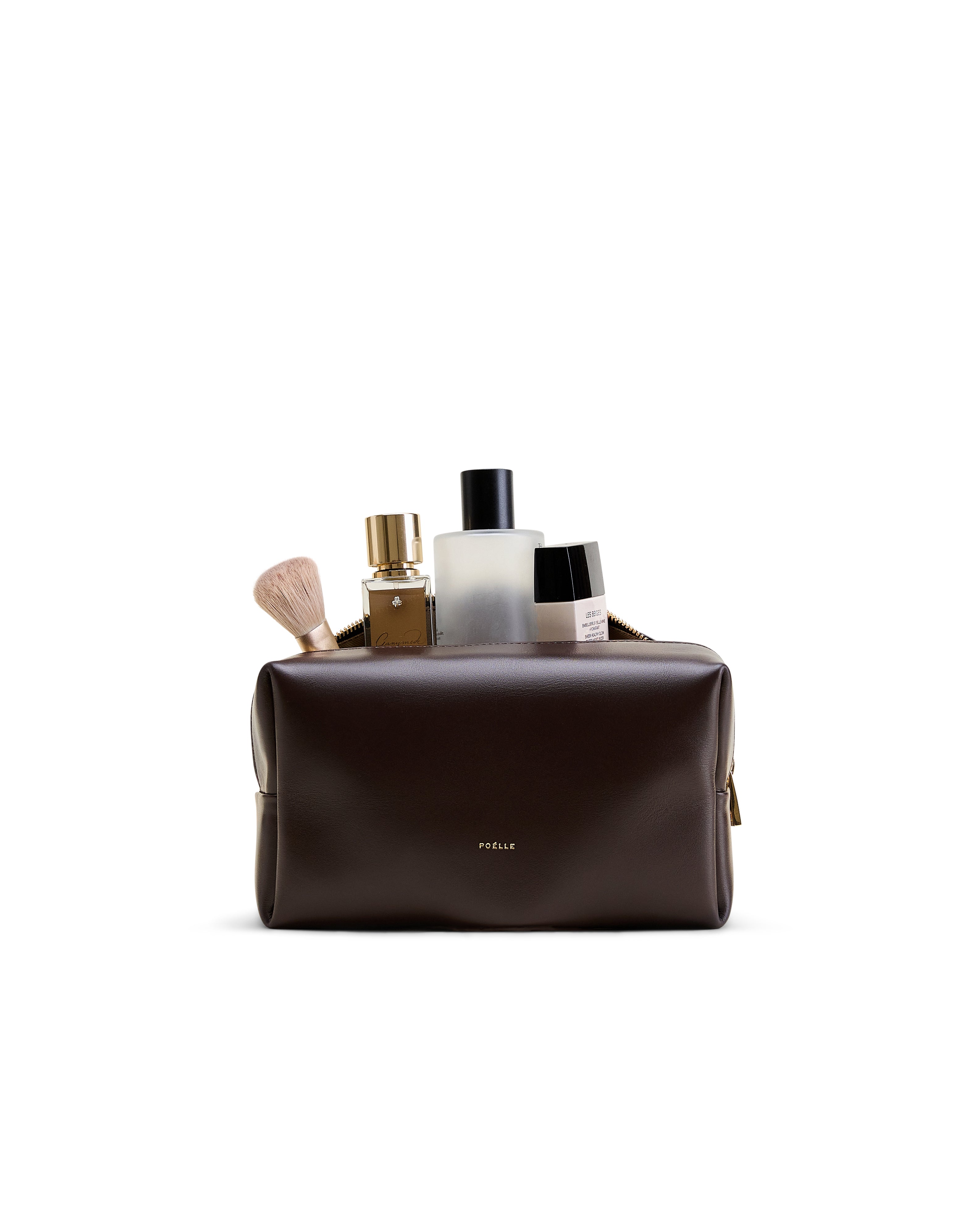 Poelle Atelier luxury cosmetic make-up bag in dark brown leather with gold logo and toiletries inside