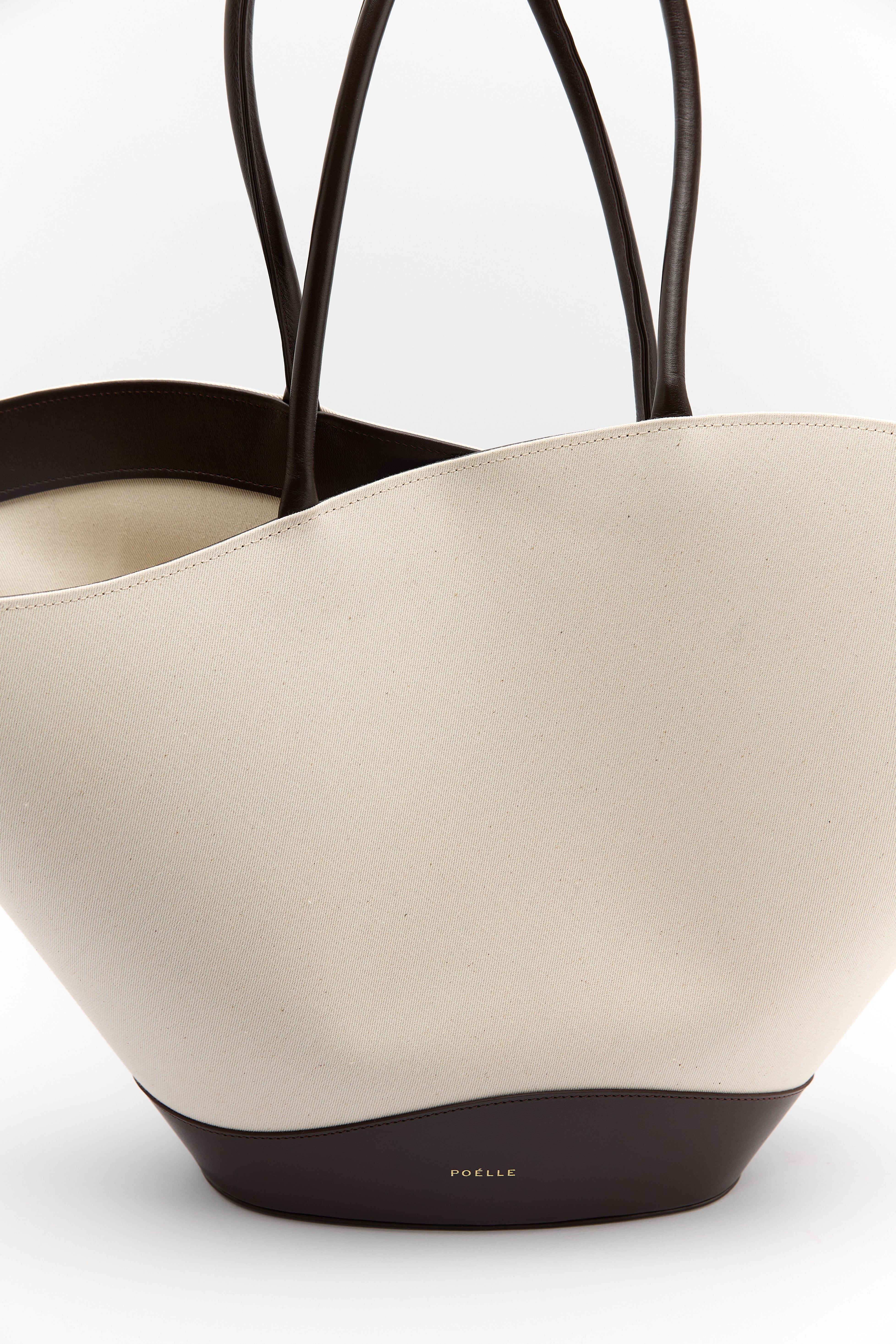 Poelle Atelier luxury summer leather bag in cream with dark brown handles and base