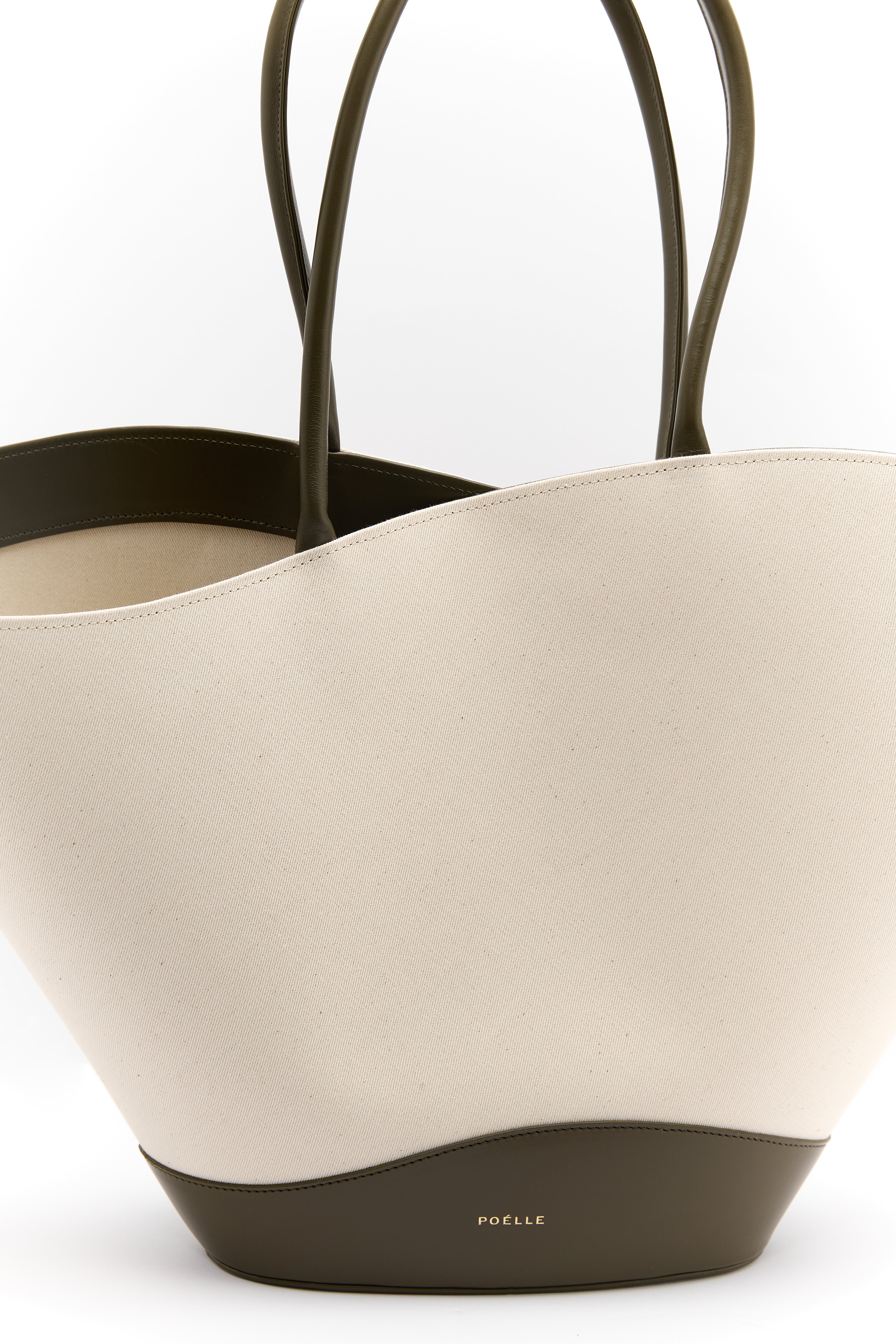 Poelle Atelier luxury summer leather bag with beige canvas body and dark leather handles