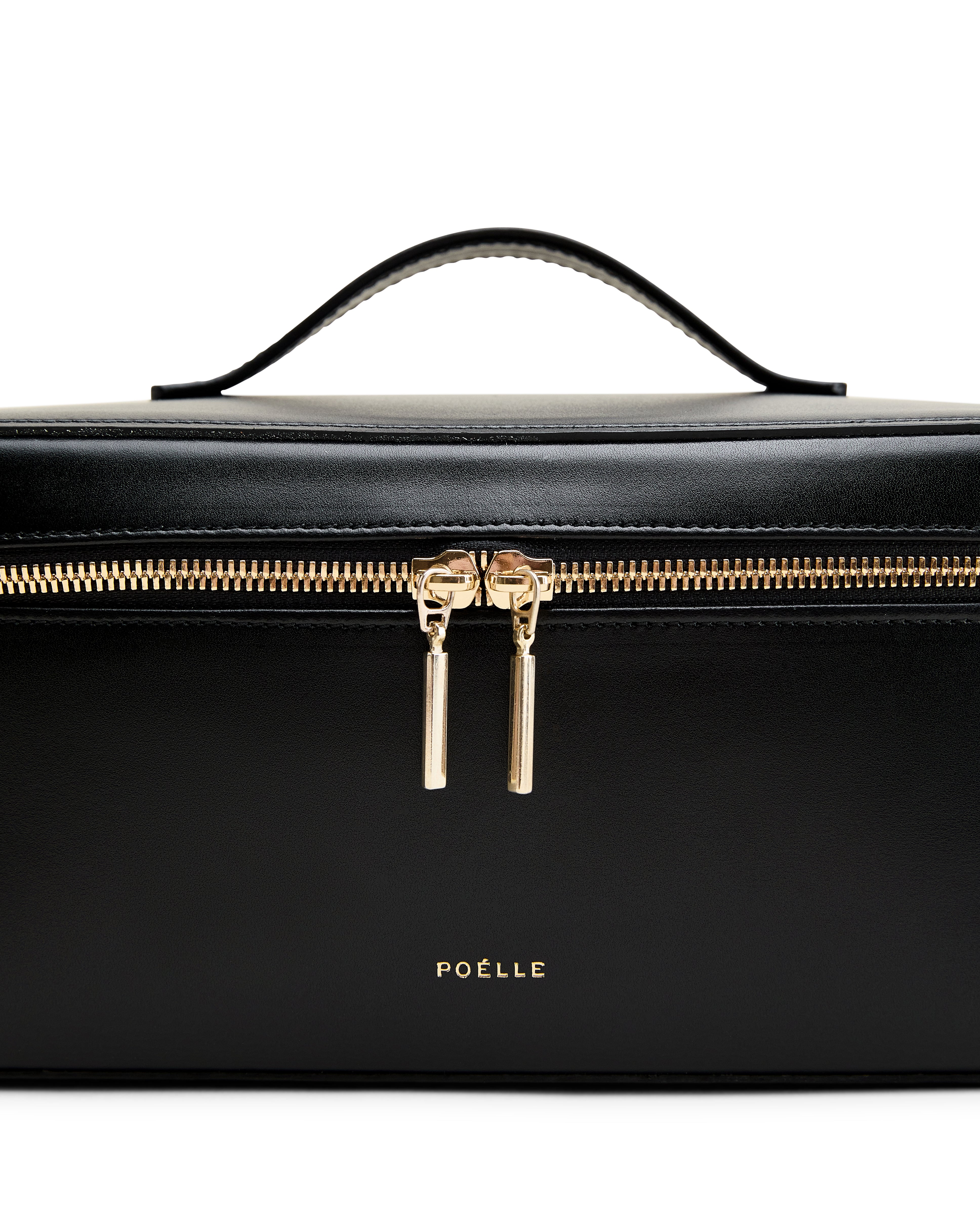 Poelle Atelier leather makeup case in black with gold zipper and top handle