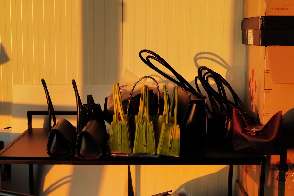 Finished bags on a shelf in the atelier