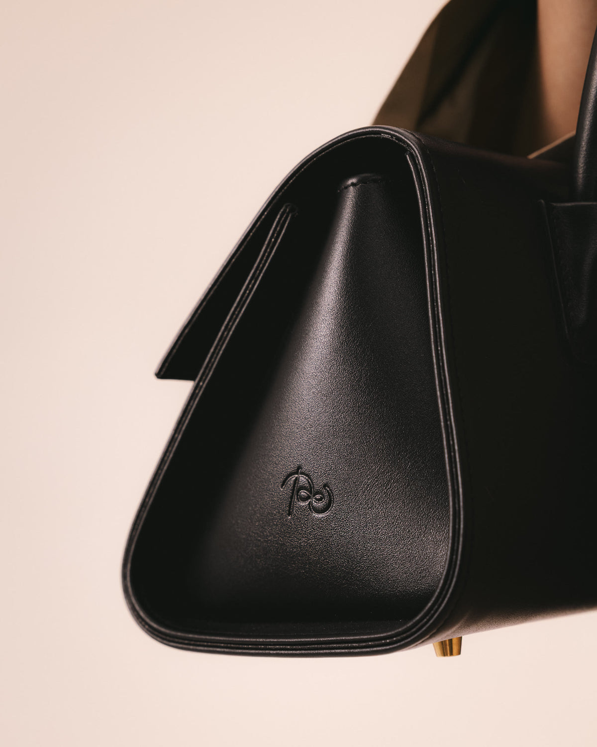 Close-up of a Poelle leather bag